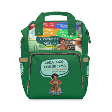 Green multifunctional diaper bag with colorful top flap and humorous Dominican mom graphic on front pocket.