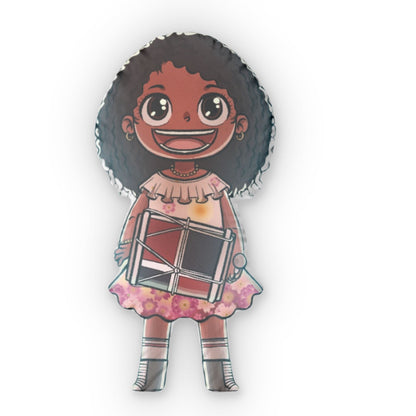 Throw pillow shaped like a smiling girl with curly hair wearing a pink dress and holding a drum.